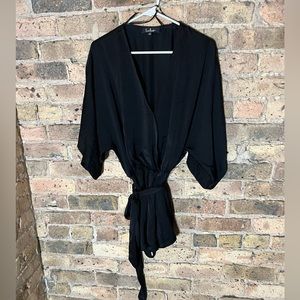 Lulu’s black satin romper with tie